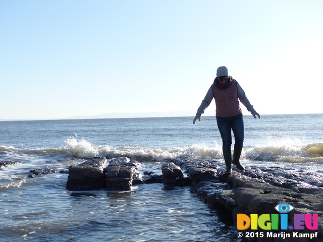 FZ011819 Jenni with waves on Llantwit Major beach